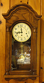Howard Miller Daniel 620-232 Westminster chime wall clock, 21st c.